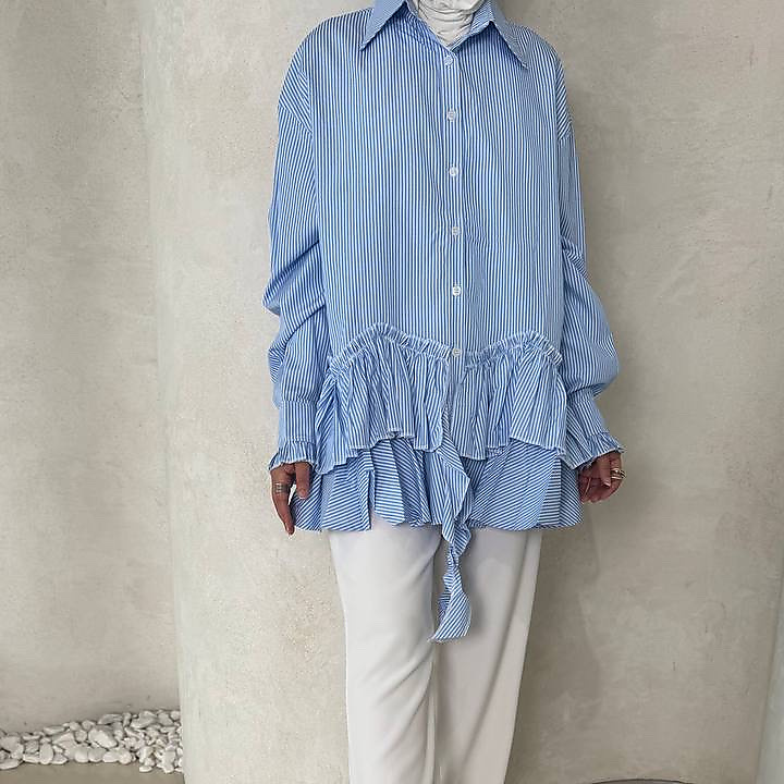 blue striped end ruffle top