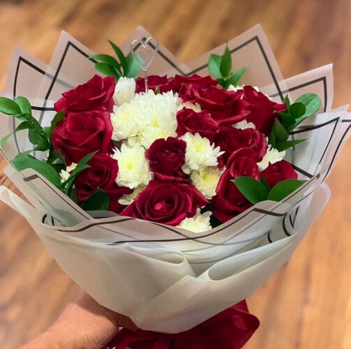 A bouquet of red and white roses