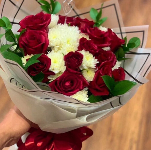 A bouquet of red and white roses