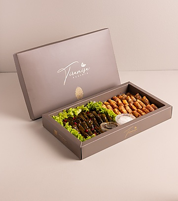 Gray box of grape leaves with musakhan