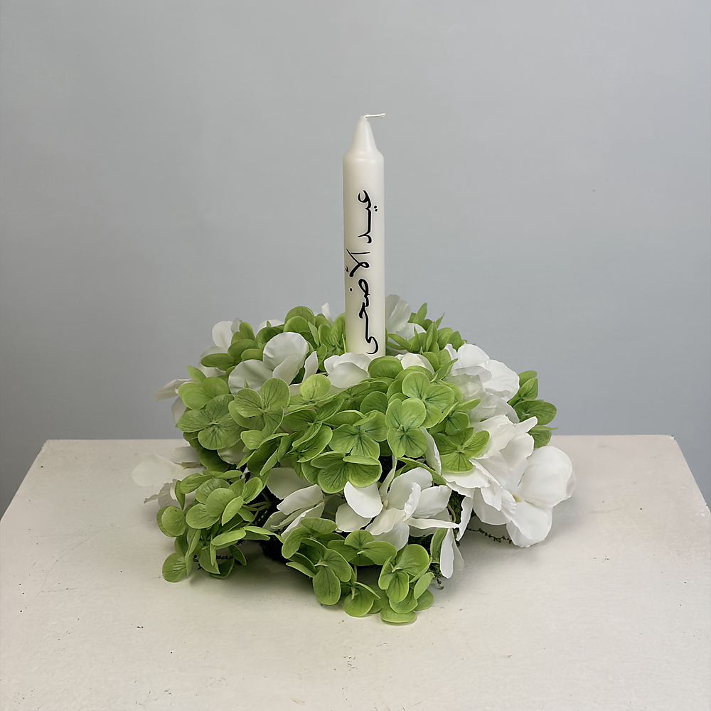 Eid Candle with green and white flowers
