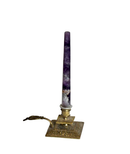 Amethyst stone on a copper candle holder.