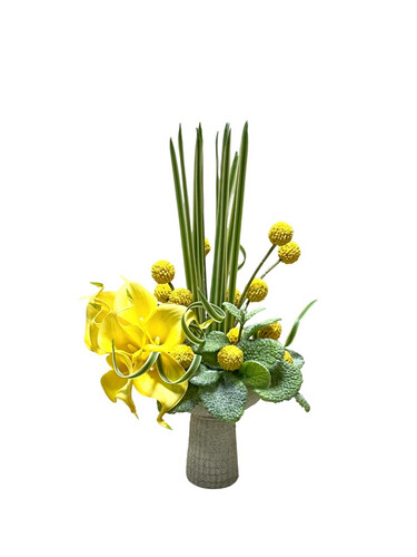 artificial  yellow kalla flowers in beige clay tray