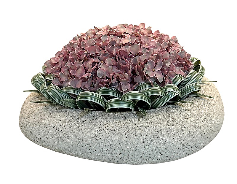Light purple hydrangea flower with greens in white clay vase