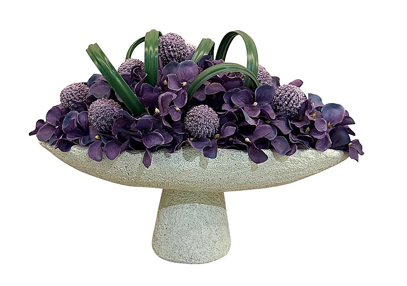 Artificial flower in oval clay vase