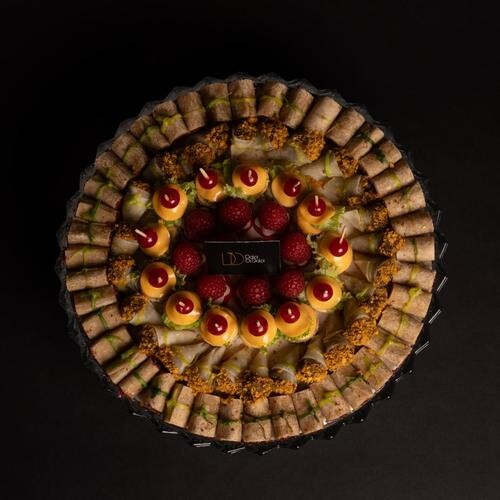 Crystal Tray contains 100 pieces of Mini Mwalah (tortila wraps : berries eqqplant - types of cheese