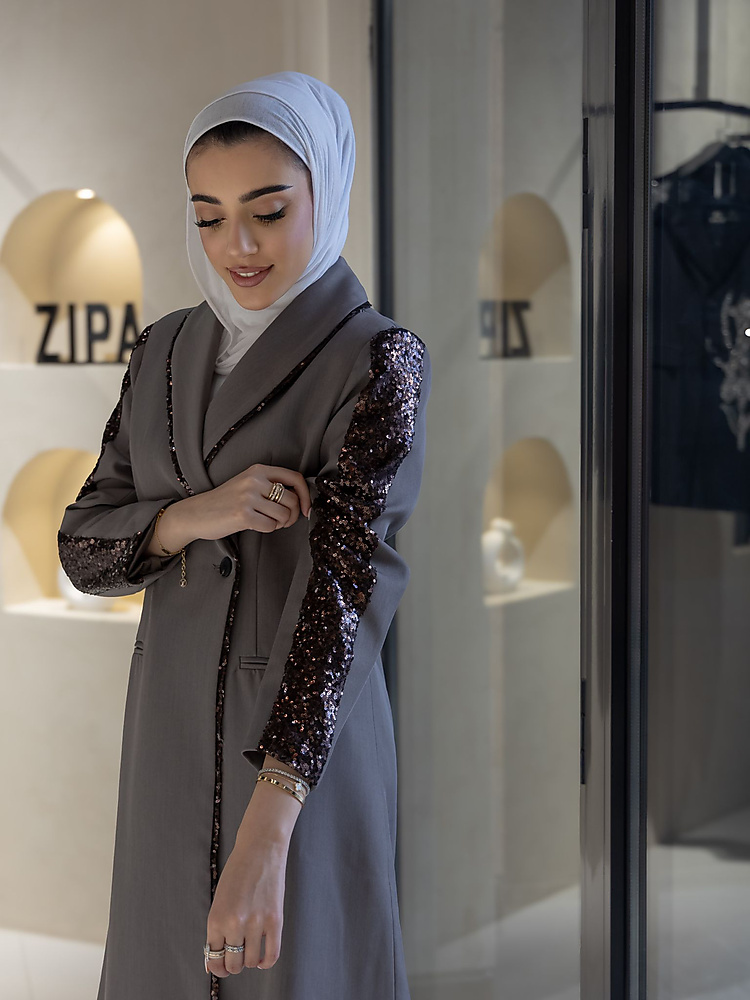 Long grey double-breasted coat with sequin-embellished sleeves