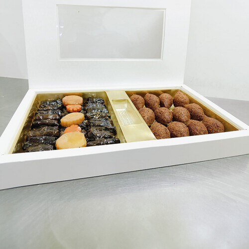 Box of kibbeh with stuffed grape leaves