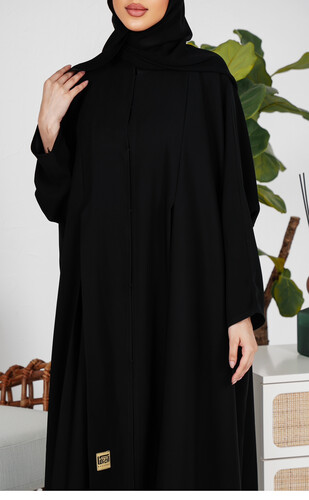 عبايه دبل كلوش ساده مع كسرات مخفيه نازله من الامام ساتره ومريحه في اللبس  خام انترنت كوري