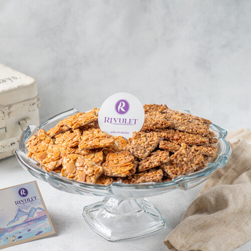 A tray of delicious peices of belgian with caramelized almond &pecan