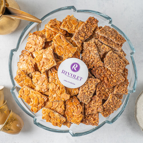 A tray of delicious peices of belgian with caramelized almond &pecan